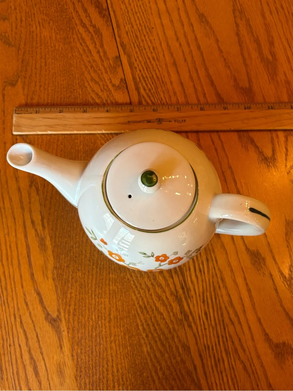 White Ceramic Teapot with Orange Floral Pattern